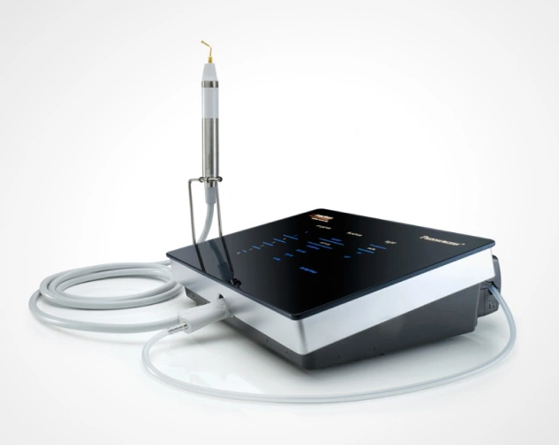 Dental ultrasonic scaler device with handpiece and tubing on white background